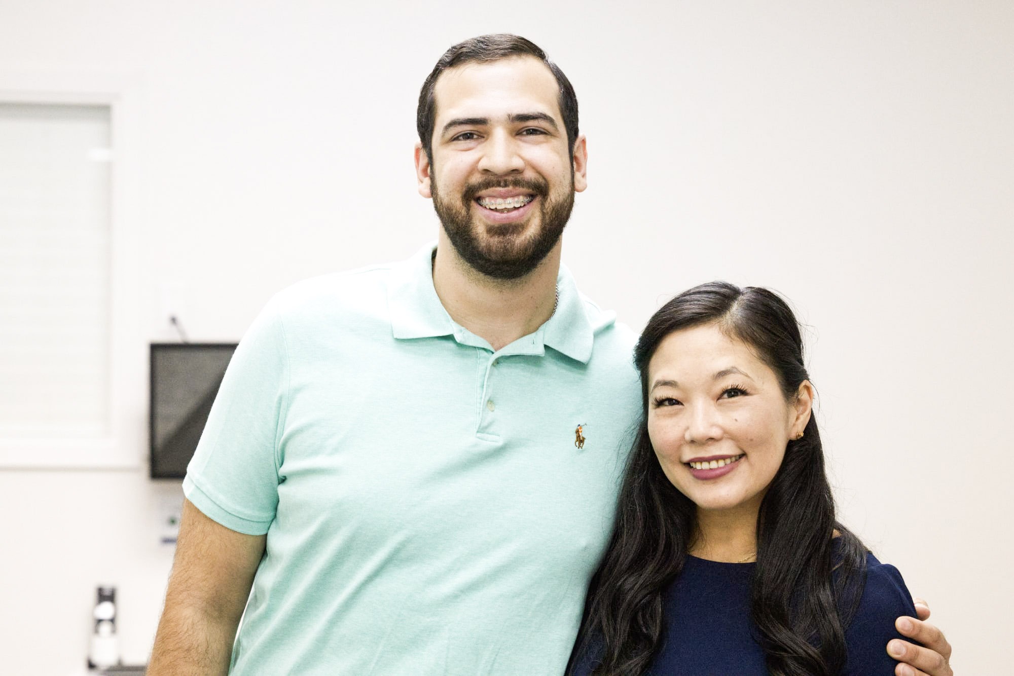 Dr. Vo, San Antonio orthodontist at Texas Family Orthodontics, smiling with a patient